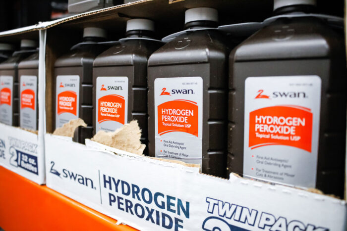 A view of several bottles of Swan hydrogen peroxide topical solution USP on display at a local big box grocery store.