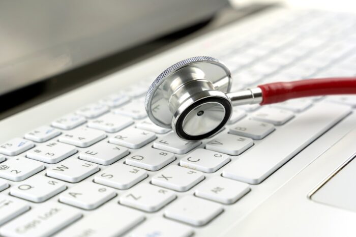 Stethoscope on a laptop keyboard -  medical data privacy, san francisco settlement, san francisco general hospital medical records