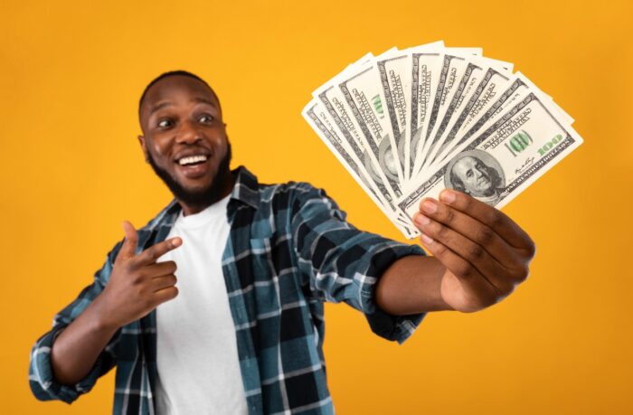 Happy Black Man Holding Money
