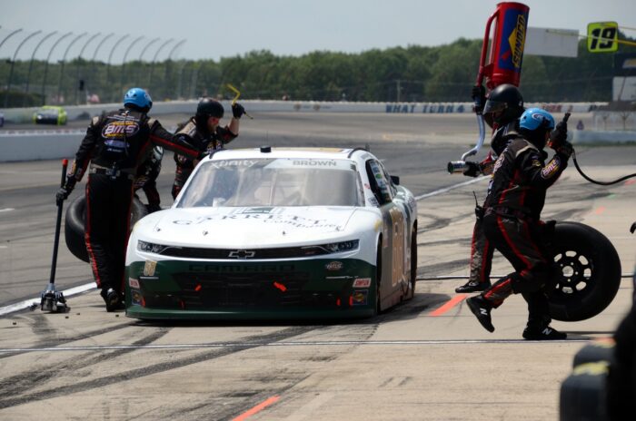 NASCAR driver Brandon Brown makes a pit stop during the 2021 Pocono Green 225 Recycled by JP Mascaro and Sons NASCAR Xfinity Series race at Pocono Raceway.