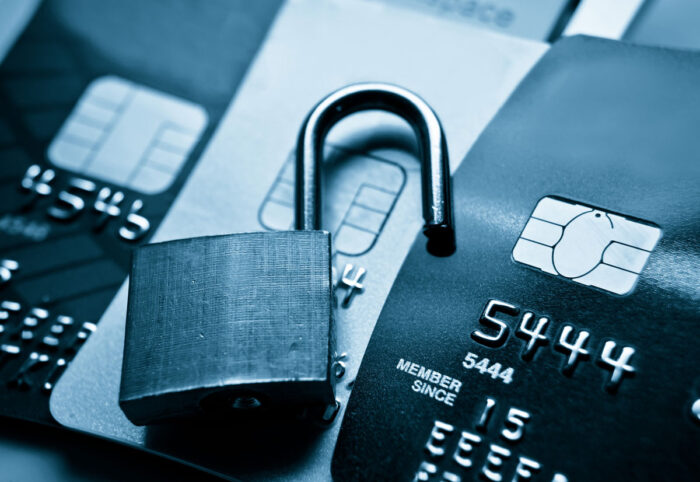 Open lock on top of credit cards. Financial data breach concept - CentralSquare Technologies LLC, click2gov, lawsuit