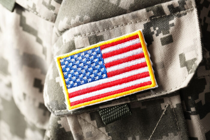 Close up of US flag on a US military uniform.