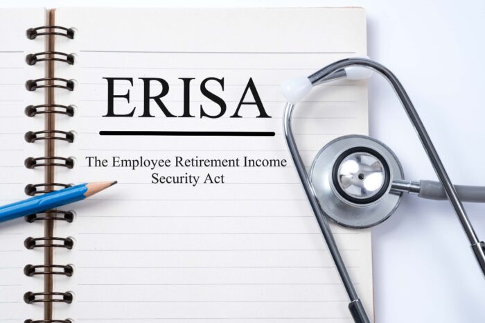 Stethoscope on notebook and pencil with ERISA (The Employee Retirement Income Security Act) words as medical concept - RWJBarnabas Health settlement, class action