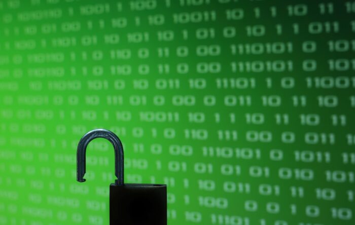 Data breach concept shot of a padlock in front of a green digital background - methodist hospitals class action settlement