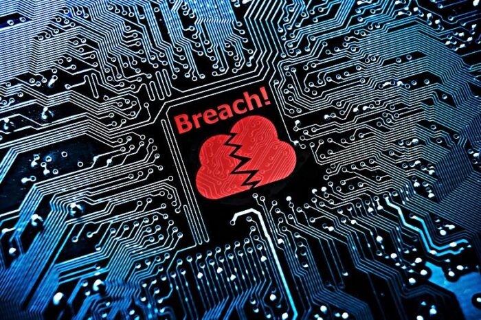 Close up of motherboard with word that reads: ‘breach’