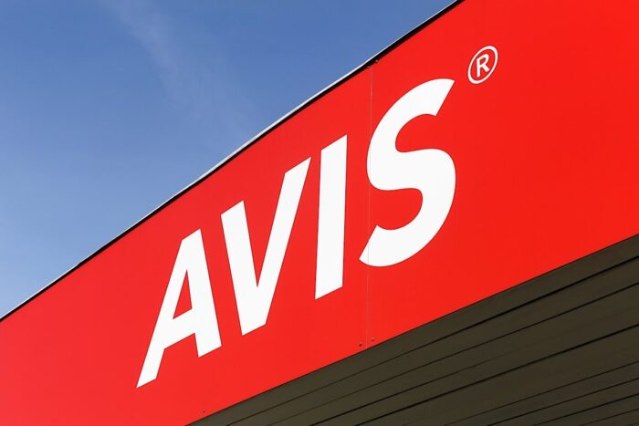 Avis logo on a wall - Avis class action setttlement