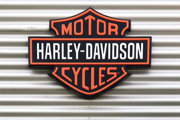 Harley Davidson signage against a metal backdrop.