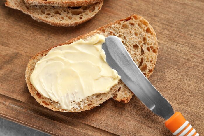 Close up of butter spread on a piece of bread - Country Crock Plant Butter 