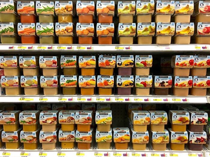 Grocery shelf with Gerber All Natural Second Stage Baby foods in peel top containers.