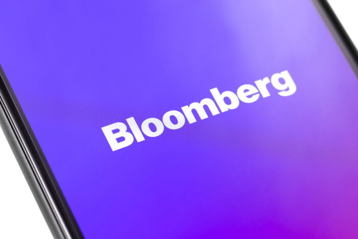 Close up of Bloomberg logo on a smartphone display, representing the Facebook data sharing class action.
