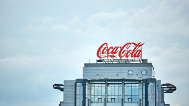 Coca-Cola advertising on the roof of a building in the city center.