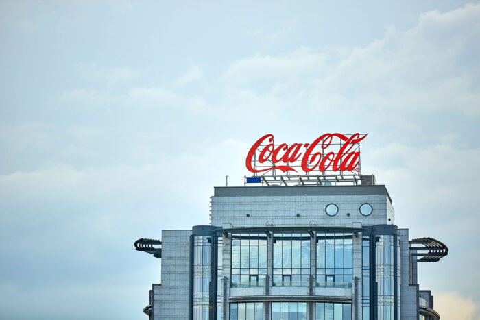 Coca-Cola advertising on the roof of a building in the city center, representing the Topo Chico class action