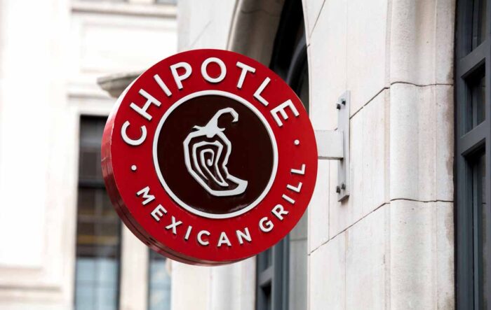 Close up of Chipotle signage on exterior of a building.