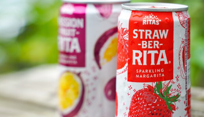 a sweating can can of Straw-Ber-Rita, with a can of Passion-fruit-rita behind - Anheuser-Busch settlement, ritas class action lawsuit