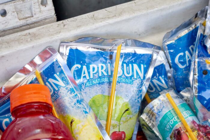 Several pouches of Capri Sun fruit drinks in an ice cooler - Kraft Heinz recall