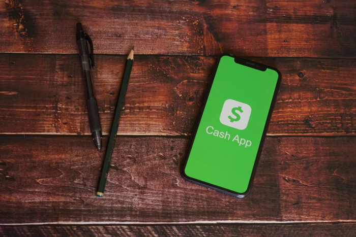 Cashapp Iphone Screen with Pen and Pencils.