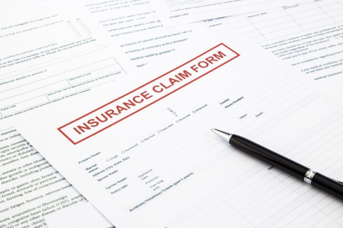 insurance claim form, paperwork and legal document