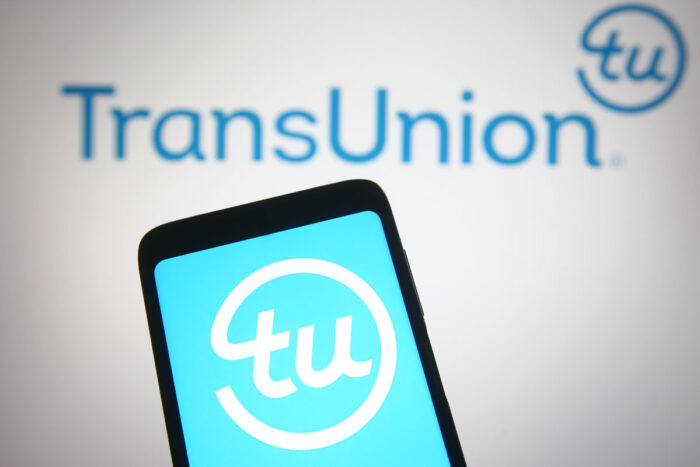 TransUnion Holding Company, Inc logo displayed on a mobile phone and a computer screen - transunion class action lawsuit