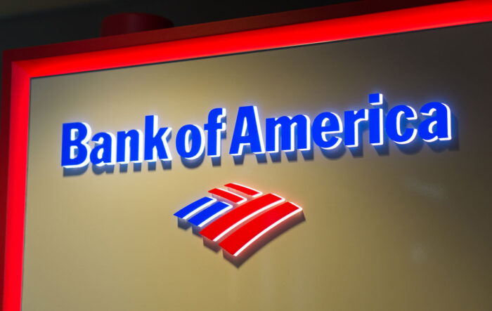 Close up of Bank of America signage at nighttime.