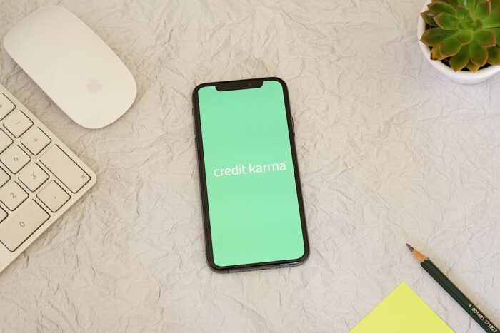 Credit Karma logo displayed on a smart screen on a desk.