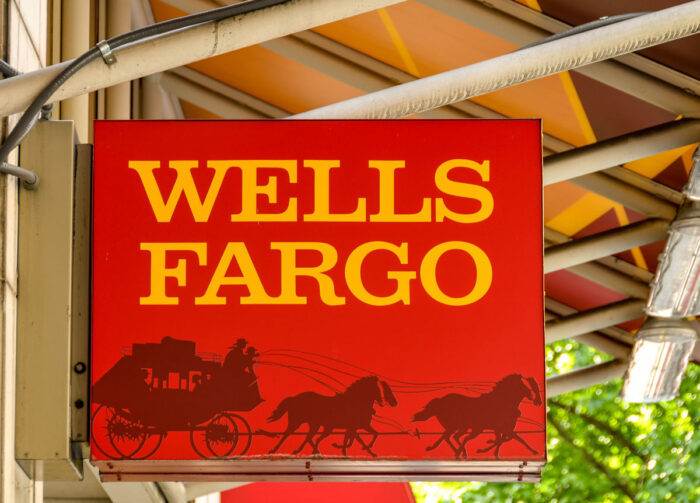 Close up view of the sign outside the entrance to a branch of the Wells Fargo bank in Seattle city centre.