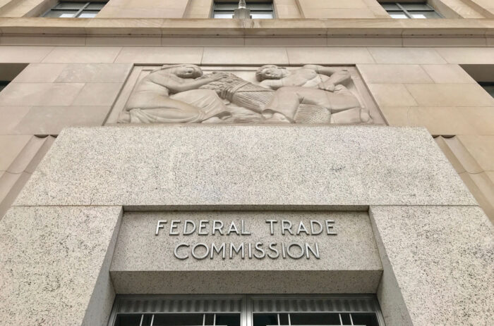 Federal Trade Commission (FTC) headquarters building entrance with sign above door and exterior.