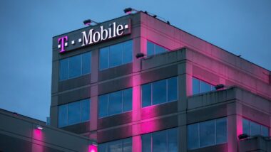 T Mobile headquarters building at night, with exterior magenta lights