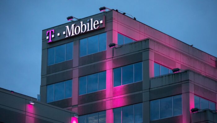 T Mobile headquarters building at night, with exterior magenta lights