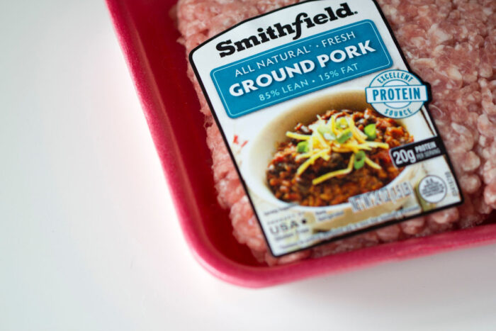 American meat-processing company Smithfield Foods branded ground pork product isolated on white background.