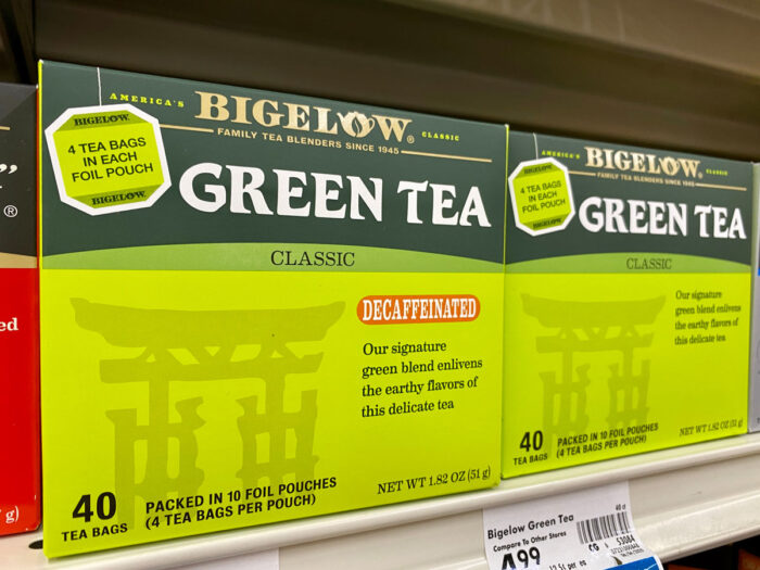Close up of Bigelow tea products on a grocery store shelf.