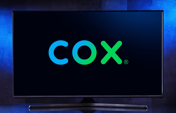 A TV set displaying logo of Cox Communications.