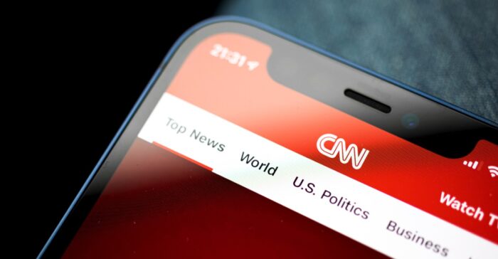 Homepage of cnn news app on the screen, banner, logo of media company