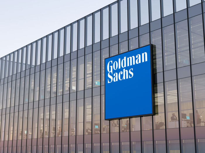 Goldman Sachs Signage Logo on Top of Glass Building.