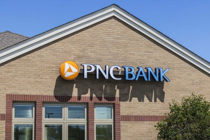 Exterior of a PNC Bank location against a blue sky.