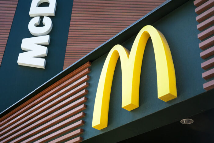 Close up of McDonald's signage on exterior of a building.