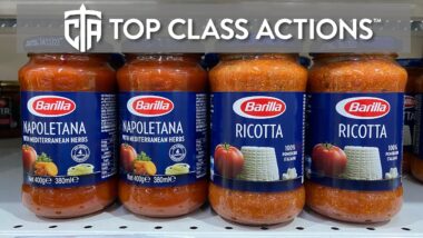 Various Barilla sauces on a grocery store shelf.