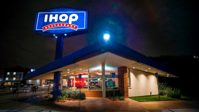 IHOP at night with neon sign on - harvest settlement, ihop class action lawsuit