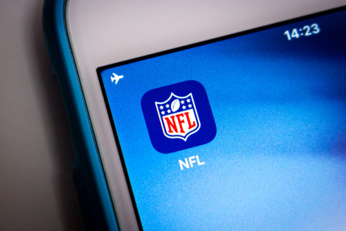 Close up of NFL logo seen on a smartphone screen.