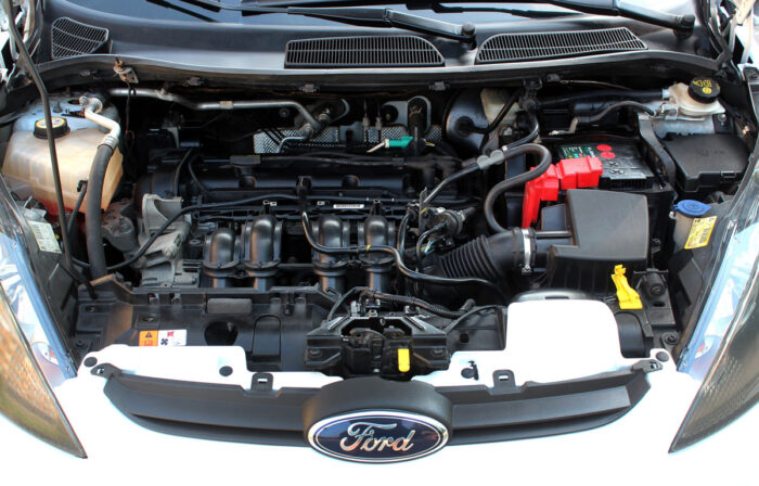 Close up of an auto engine of a Ford vehicle.