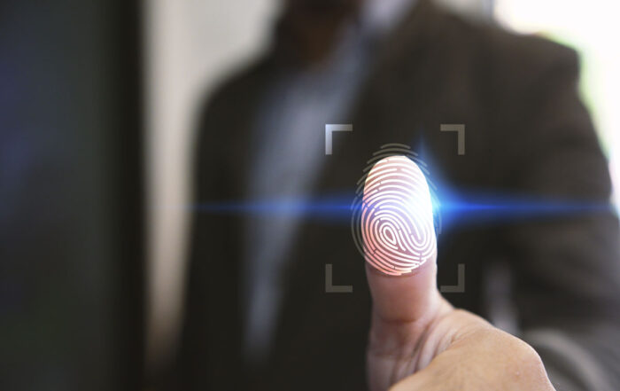 Close up of a businessman's thumb with a thumbprint overlay. Biometric data concept.
