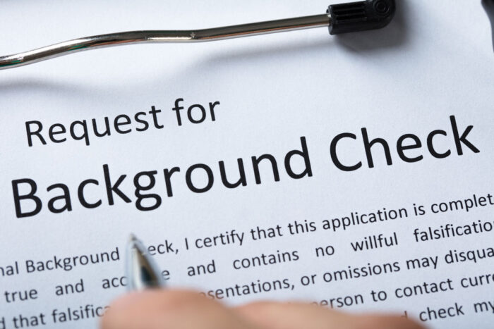 High Angel View Of Criminal Background Check Application Form With Pen.