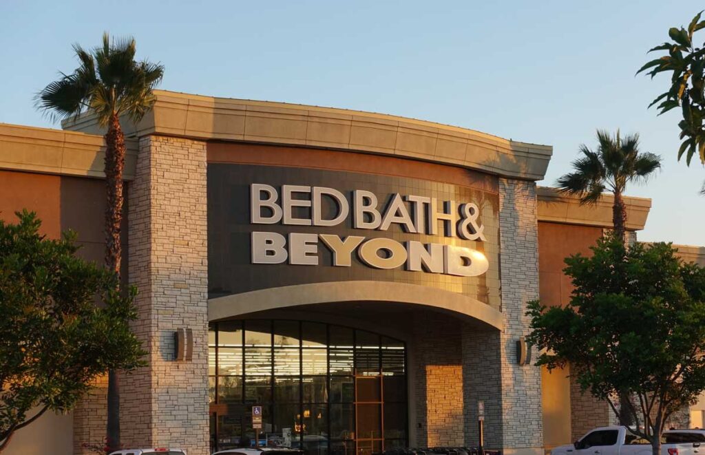 Storefront of a Bed Bath & Beyond in California strip mall during golden hour.