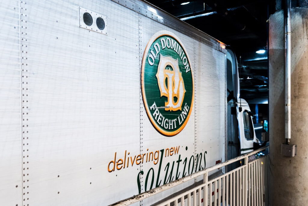 Close up of Old Dominion Freight Line logo on exterior of transportation vehicle.