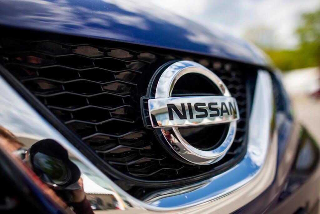 Close up of Nissan emblem on front bumper of vehicle - Infiniti class action