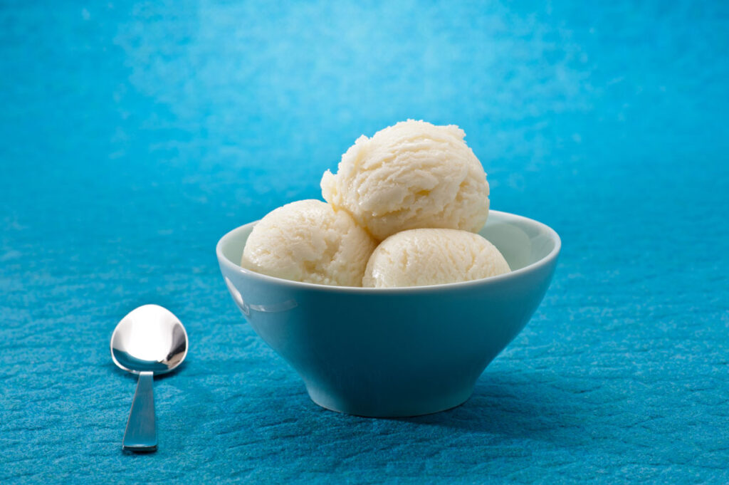 Ice Cream cup isolated over blue background.