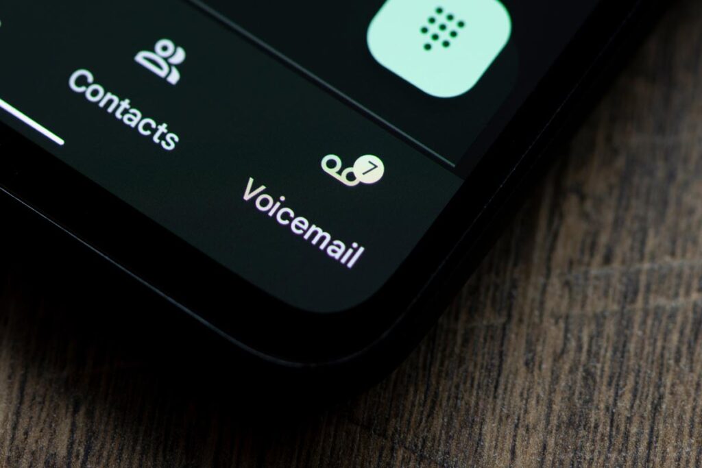 Close up of voicemail icon displayed on a smartphone screen.