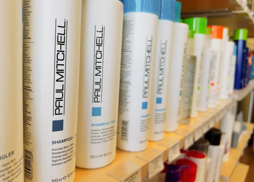 Selective focus on Paul Mitchell products on a shelf.