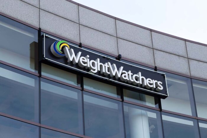 Close up of Weight Watchers signage on exterior of building.