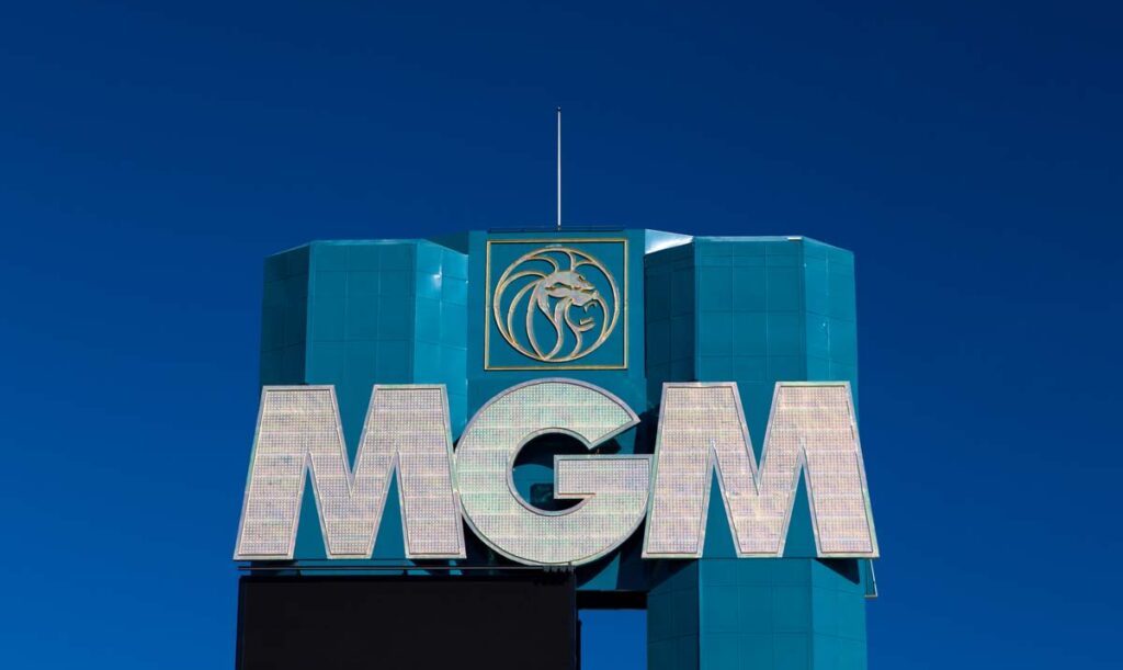 Close up of MGM signage against a dark blue sky.
