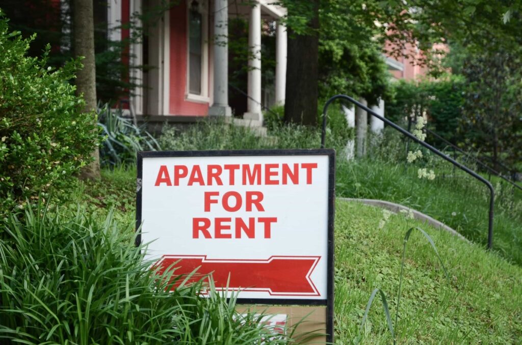 Close up of an apartment for rent sign.